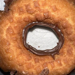 a chocolate frosted donut
