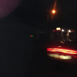 a blurry image of a car at night