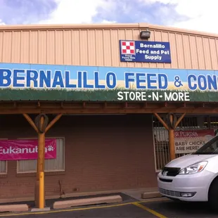 a car parked in front of a store