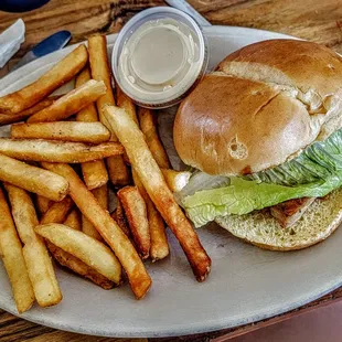 Blackened chicken sandwich- pepperjack cheese, lettuce, tomato, onions and spicy mayonnaise on a Brioche roll.