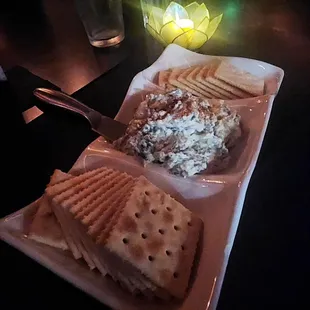 a plate of crackers and a sandwich