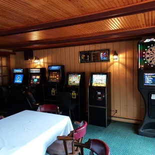 a row of arcade machines in a restaurant
