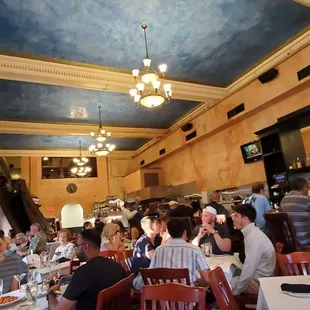 a group of people eating in a restaurant