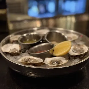 Raw oysters from New Brunswick Canada enjoyed with a truffle mignonette.