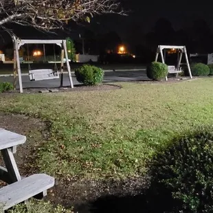 a picnic table and swing set