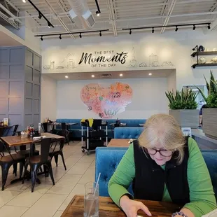 a woman sitting at a table