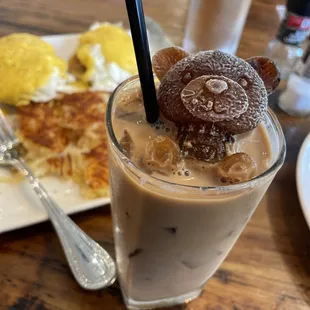 Yummy Eggs Benedict, perfectly golden, crispy hash browns, and caramel iced latte w/ teddy bear coffee ice cube. Delicious!