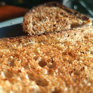 Perricone&apos;s multi grain toast and a few poached. Perfect breakfast al fresco.