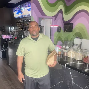 a man standing in front of a counter