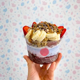 a hand holding a dessert