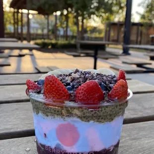 Acai base at the bottom, then coconut dream base on top, matcha chia pudding, granola, fruit, agave, cacao nibs, my BYOB