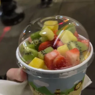 Mango, strawberry, and raspberry frozen yogurt with kiwi, pineapple, strawberry, mango, and bursting boba topping