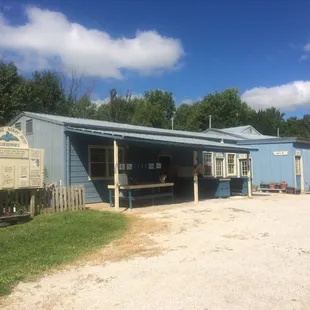 a blue building with a blue roof