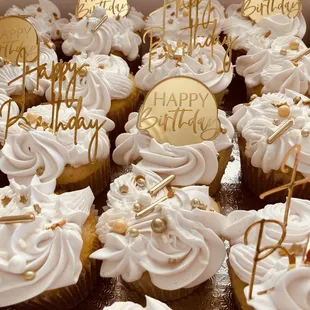 Gold and white birthday cupcakes