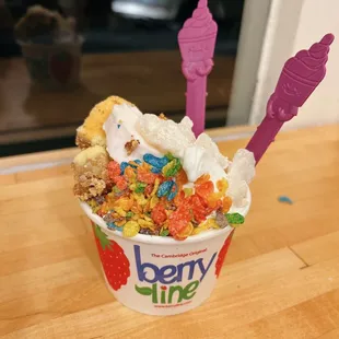 Original tart and strawberry froyo with fruity pebbles, mochi, and cheesecake