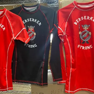 three t - shirts on display