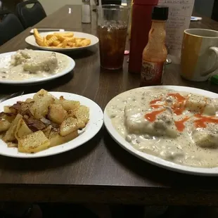 Biscuits &amp; Sausage Gravy with home fries with onion