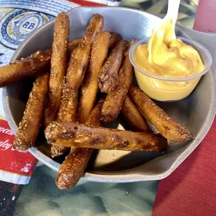 a bowl of pretzels and mustard