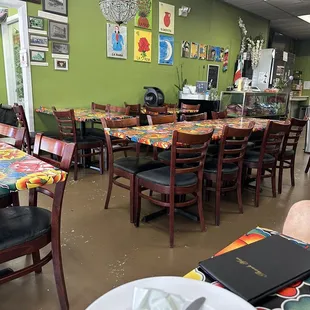 empty tables and chairs in a restaurant