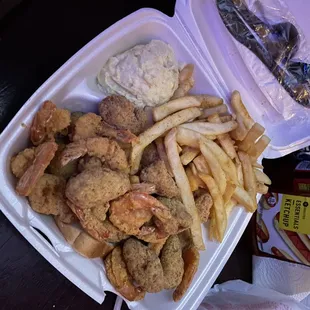 a tray of fried chicken and french fries
