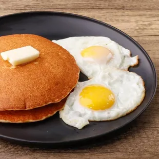 a plate of pancakes and eggs