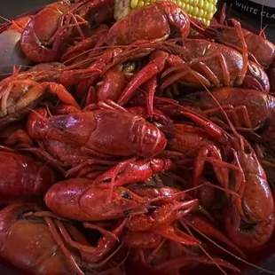 a plate of crawfish and corn
