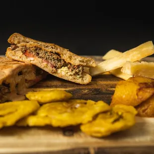 a cut in half sandwich on a cutting board