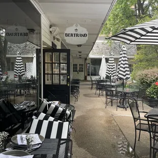 outdoor dining area with tables and chairs