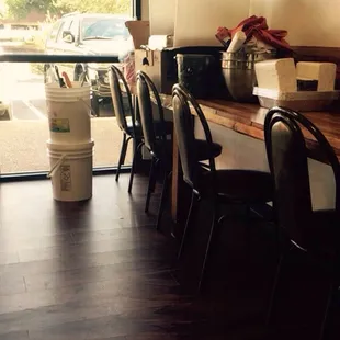 Stacking up in main dining area, unprofessional, but only two tables filled.