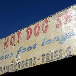 a sign for a hot dog shop
