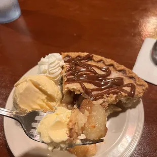 Caramel nut apple pie with vanilla ice cream heated just right