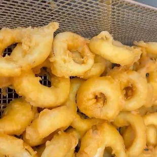 Hand battered onion rings with sauce.