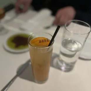 a glass of iced coffee on a table
