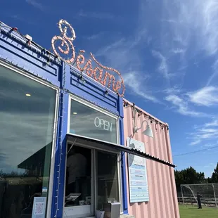 a blue and pink food truck