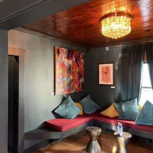 a living room with a couch and a chandelier