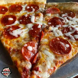 two slices of pepperoni pizza