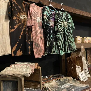 a variety of t - shirts on display
