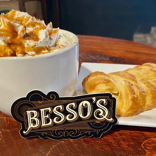a cup of coffee and croissants