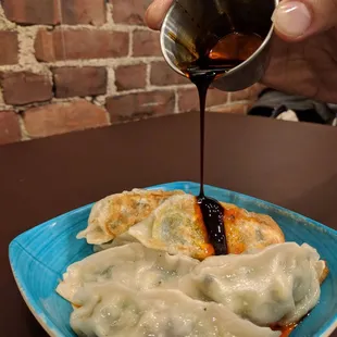 Veggie dumplings with chili sauce