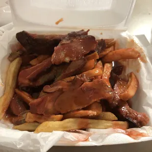 a tray of fries and bacon