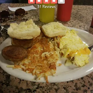 Breakfast special....eggs with cheese and onions, sausage, hashbrown, and a biscuit.