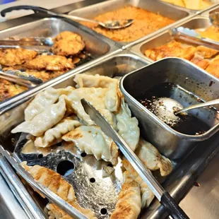a variety of food items in a buffet