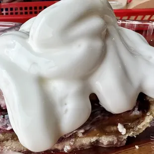 a strawberry pie with whipped cream