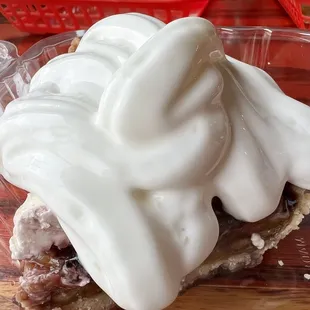 a strawberry pie with whipped cream