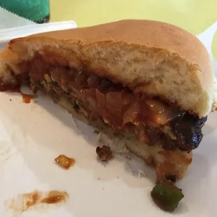 Hickory cheeseburger cut in half. Pretty good. Lots of tangy sauce and onions on this burger.