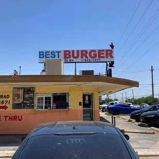 a car parked in front of a restaurant