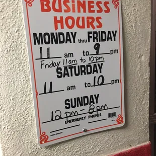 a sign for business hours