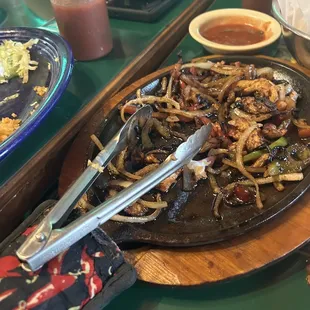 The bottle of salsa you get each, chicken fajitas,?rice, refried beans sour cream and cheese along with homemade tortillas