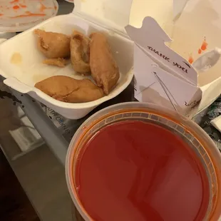 a bowl of soup and a bowl of fried chicken