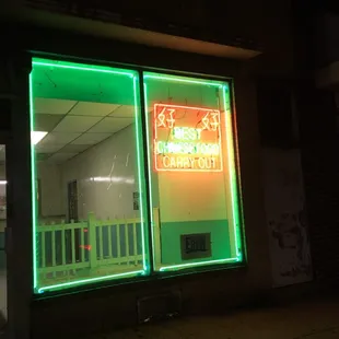 a neon sign in a window